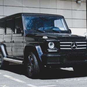 Black Mercedes SUV parked in an urban setting, highlighting luxury and style.